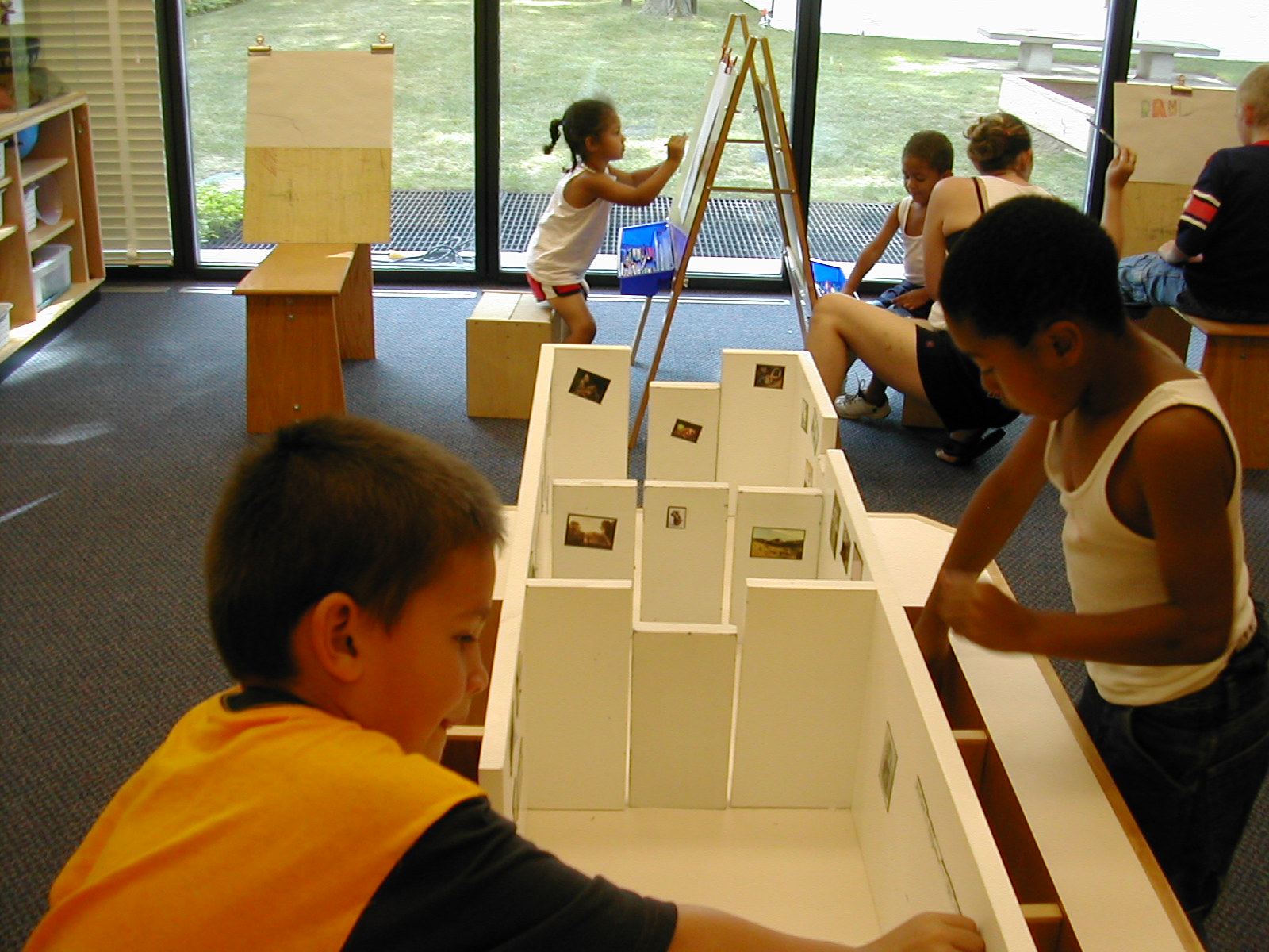 Children curating a model art gallery
